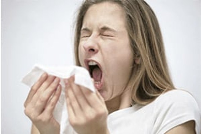 Woman Sneezing